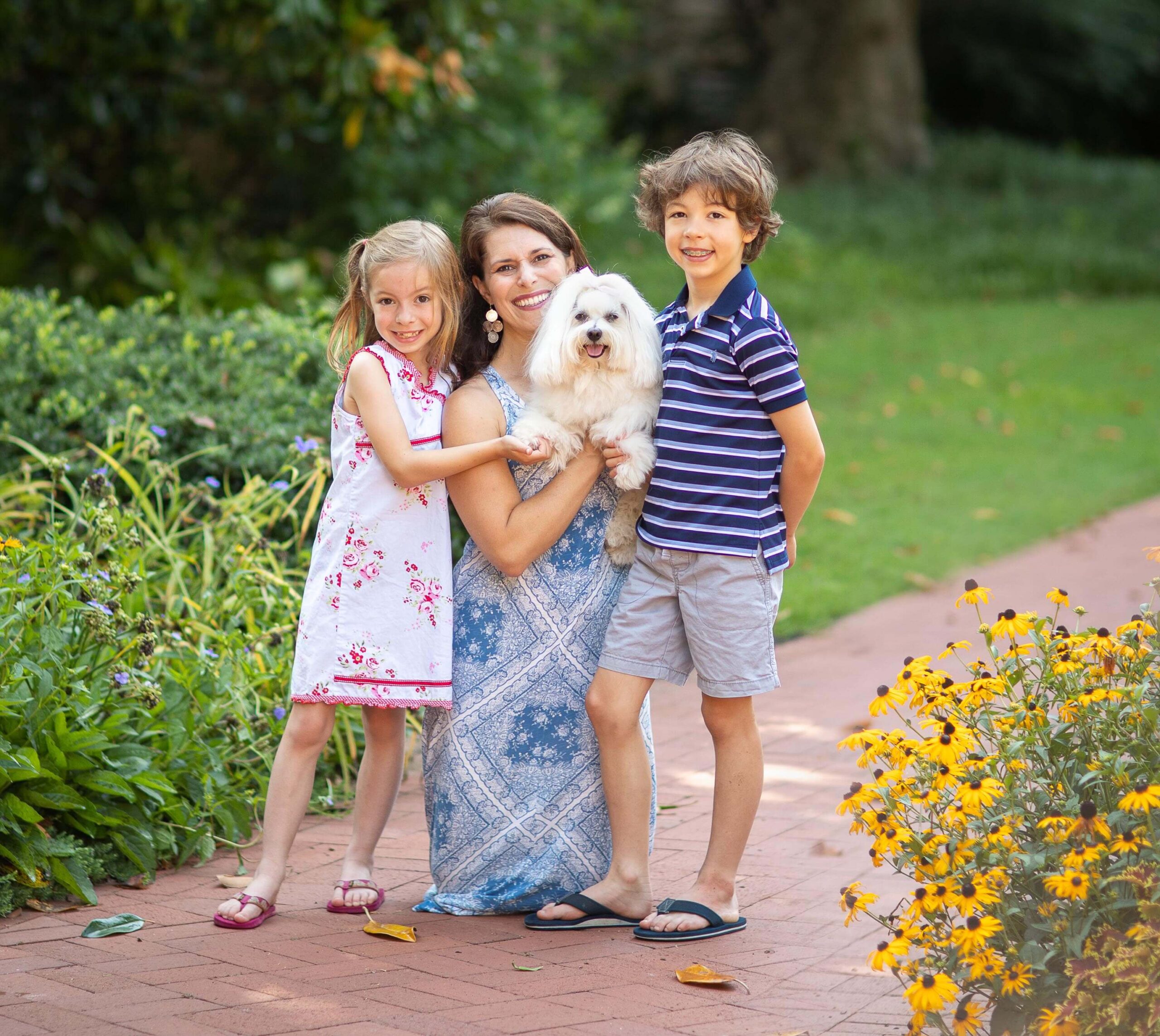 Family Portrait Photography of an aunt posed with her niece, nephew and her little white dog
