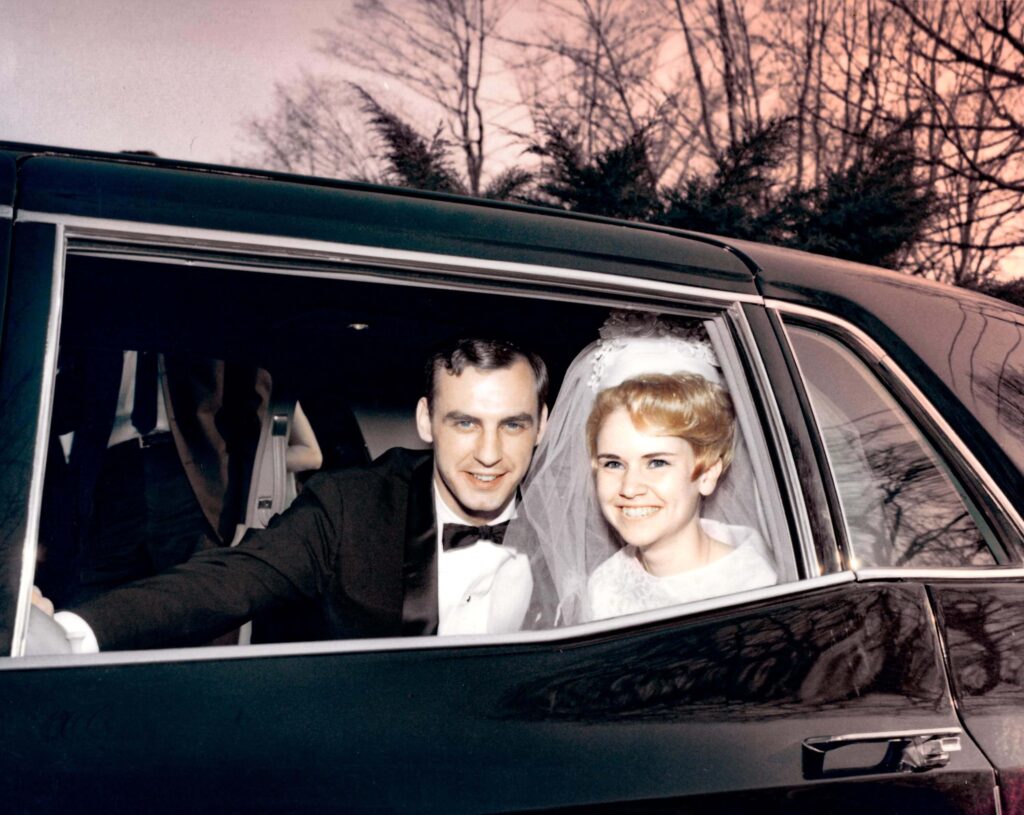 Photo Restoration - Bride and Groom pictured inside their car with the color restored to the photo